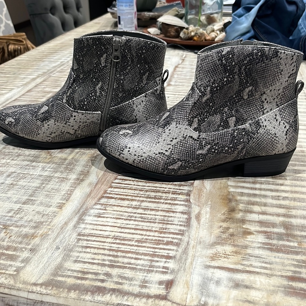 Woman’s snake print boots